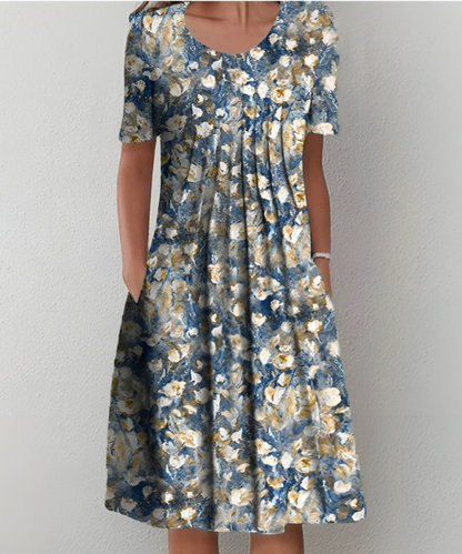 שמלצת פרחים אלמה בלומסטרקוג™ | שמלת קיץ אלגנטית וקלה עם דפוסי פרחים צבעוניים