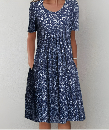 שמלצת פרחים אלמה בלומסטרקוג™ | שמלת קיץ אלגנטית וקלה עם דפוסי פרחים צבעוניים